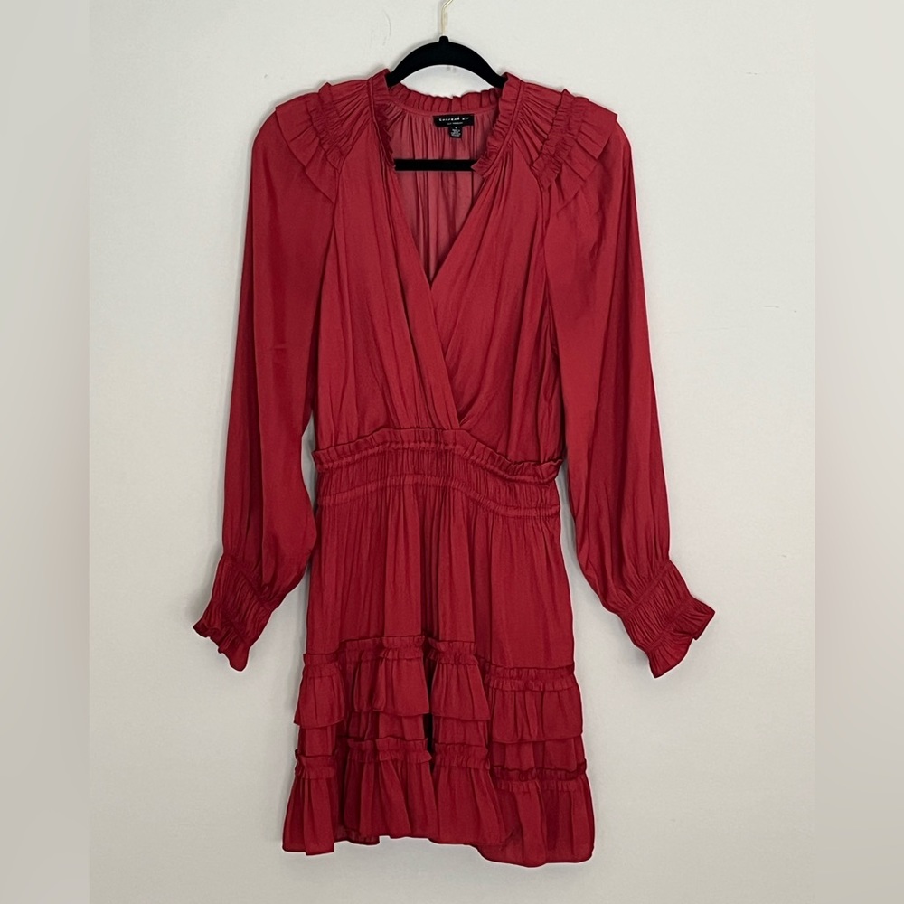Dinner/ party dress in a deep rust color. Silky with feminine smocking details